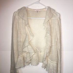 Cream colored cardigan.